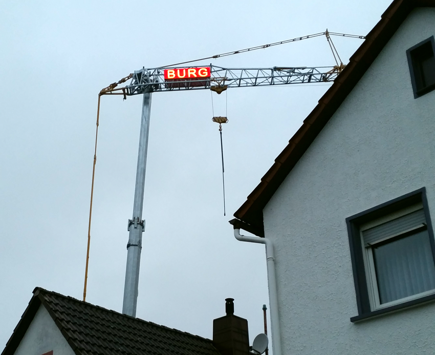 Leuchtwerbung Kran BURG-HAUS
